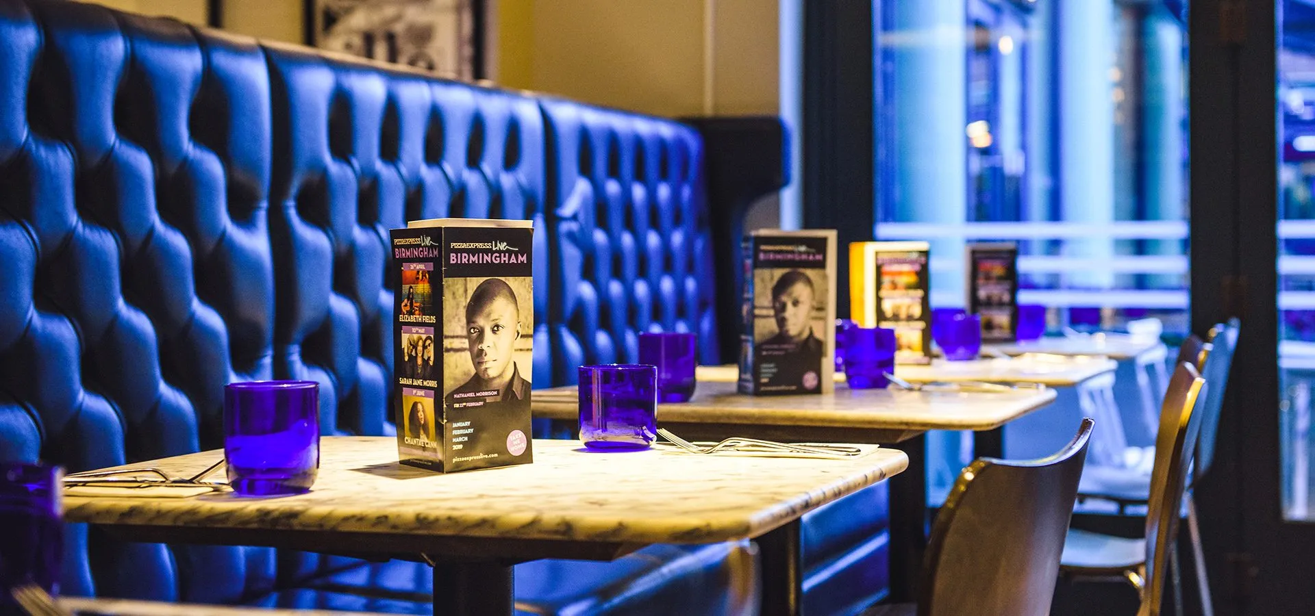 A PizzaExpress restaurant interior with table menus, one of the channels the brand could not yet link up